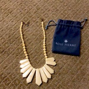 Rose Pierre Ivory stone necklace. Worn a few times. Like new. Comes with bag.
